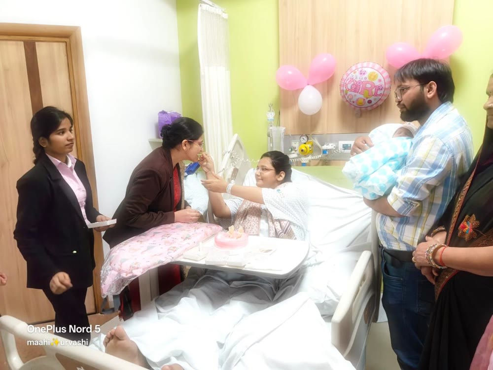 Dr. Asna Zehra Naqvi sharing a newborn celebration with a family in Lucknow